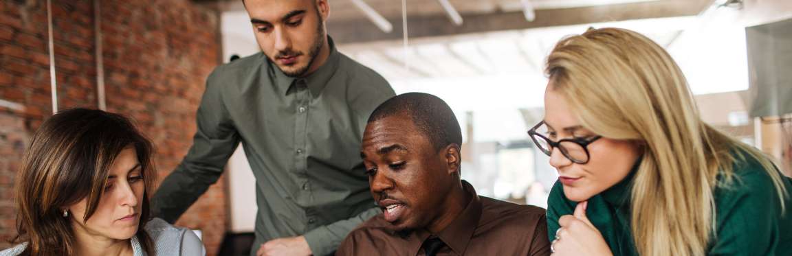 A team of colleagues working together in an office.