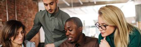 A team of colleagues working together in an office.