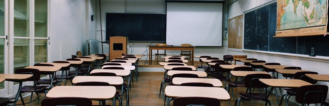 A classroom full of empty desks.