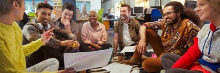 A group of Gen Z employees in a laid-back office setting.