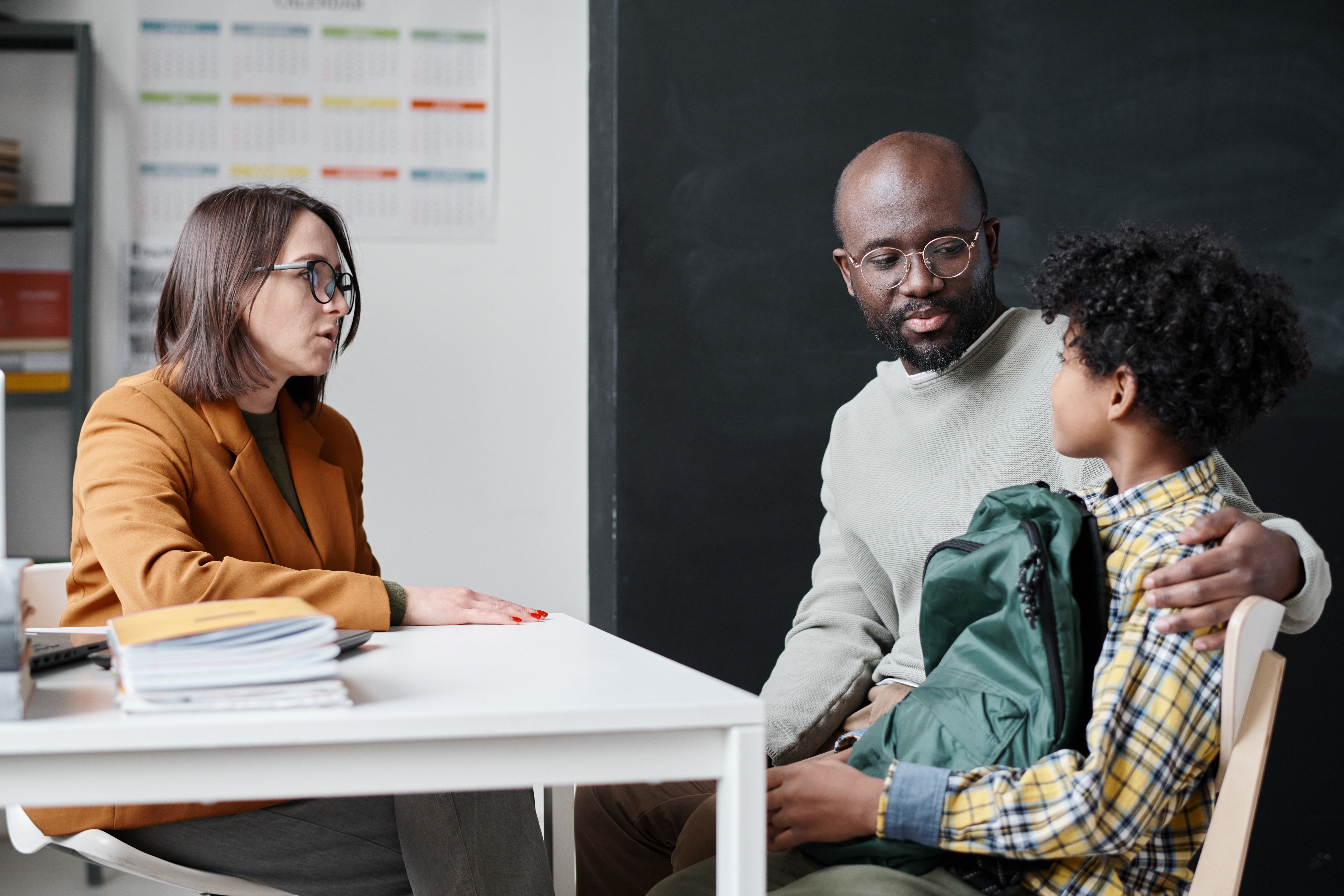 Two young people sitting together, illustrating youth mental health concerns
