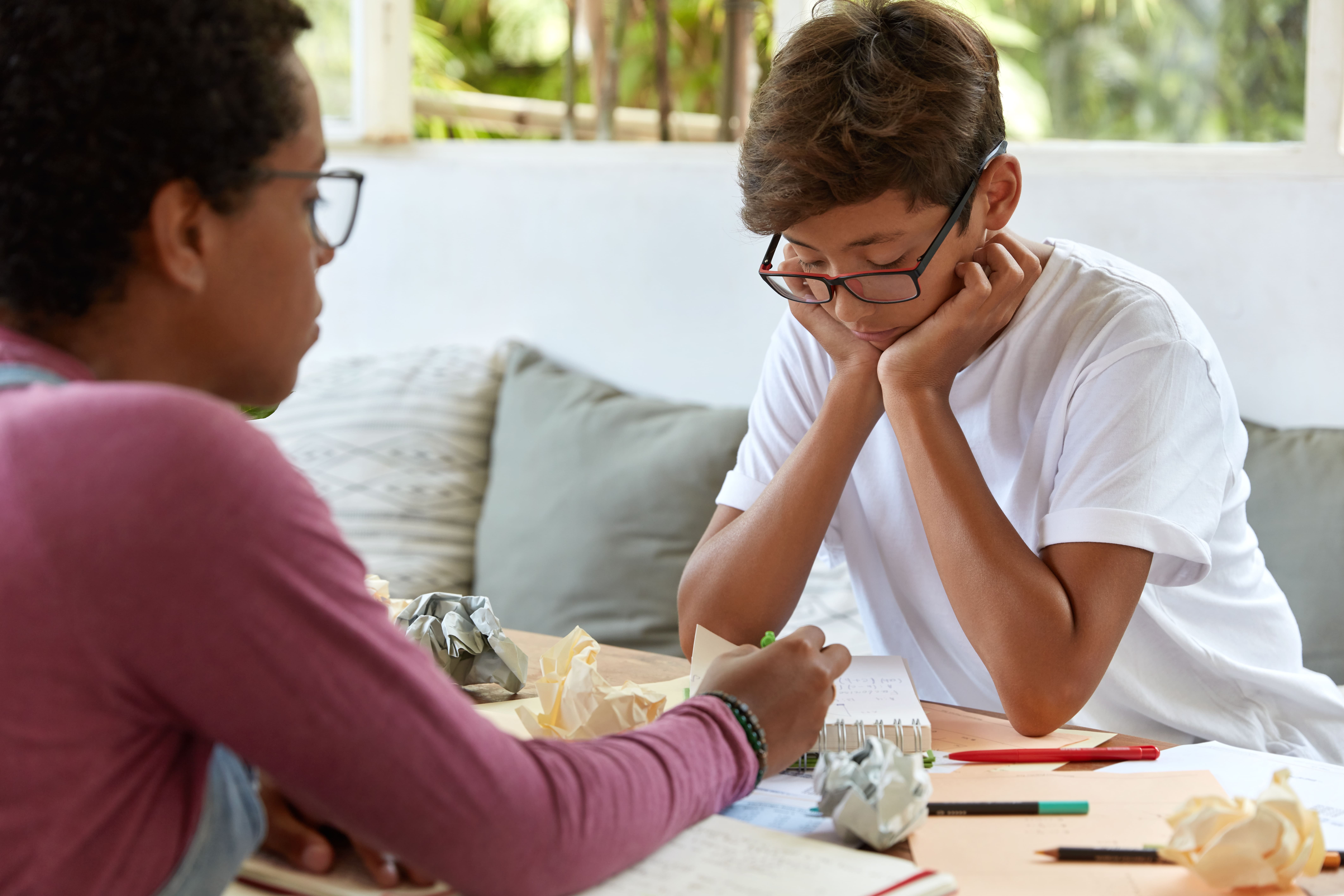 Two young people sitting together, illustrating youth mental health concerns